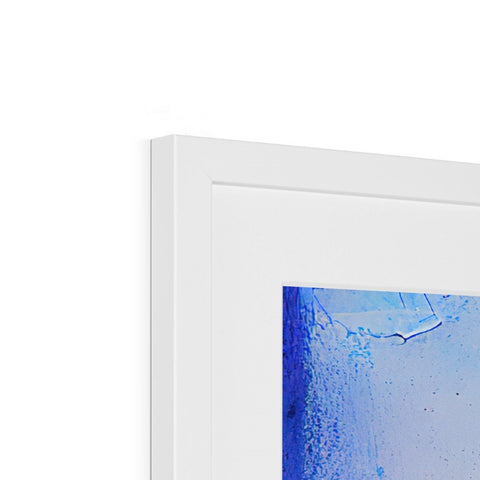 A picture frame with a picture of a white wall framed in blue and white.