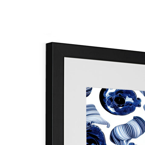 An image of a picture frame placed over a framed print on a shelf.