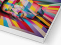 The top of a hardcover magazine covers a colorful image of an artwork on a painting