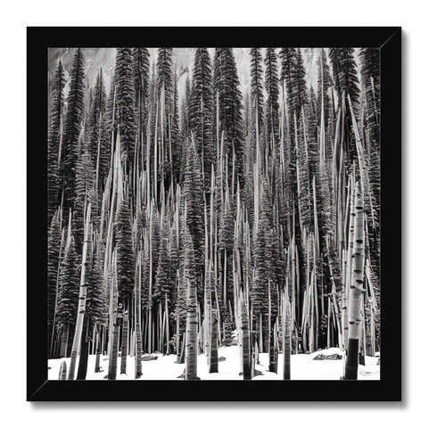 A black and white art print on a wooden frame set in the middle of a forest
