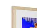 A wooden picture frame with some light on it lying atop a glass wall for a picture