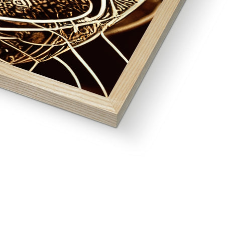a close up of a wooden book with gold foil on it with a wooden table top