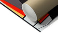 A roll of paper wraps with colorful tape at the sides.