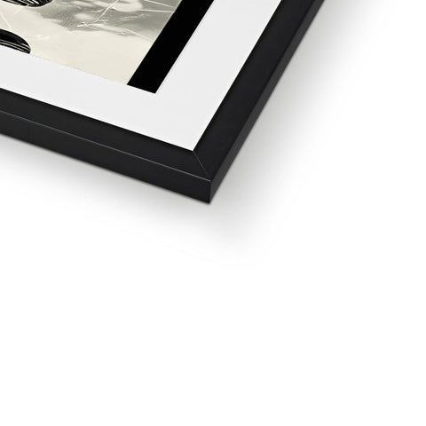 A picture frame with a black and white photograph on top in a frame