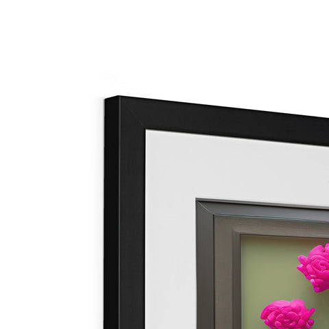 A picture of a picture frame with flowers on it in a frame hanging from a wall