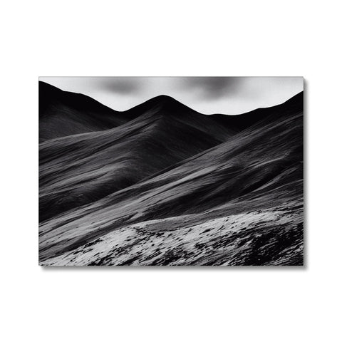 Black and white art print of mountains on a sunny day surrounded by trees.