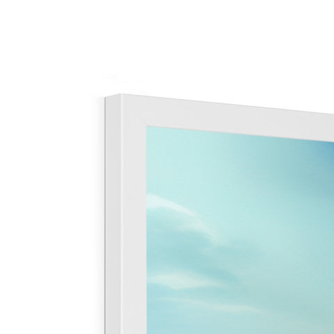 A small white screen is sitting in front of a picture frame that says "sky".