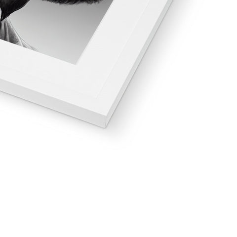 A black and white picture frame that contains a man with a beard.