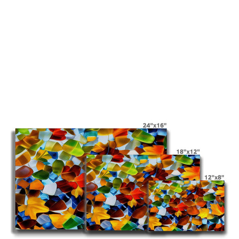 Multiple colorful ceramic tiles sitting on a counter top with two other pieces of tile next to