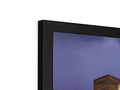 Two flat screen television monitors display different colors of television content.