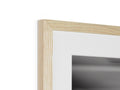 a picture frame held in a wooden frame with light grey and white in it
