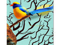 A large colorful bird perched on a tree branch next to a colorful painting.