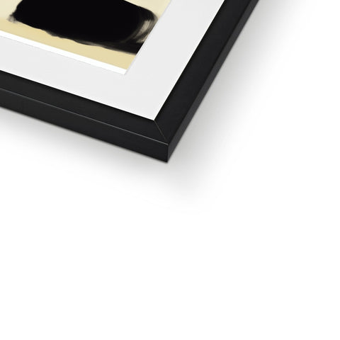 A picture of a white gold picture frame on a black and brown box.