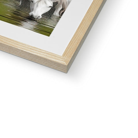 A picture in wood frame with a close up of a horse sitting next to a water