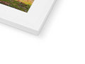 A photo on top of a book covered by a white picture frame in some white paper