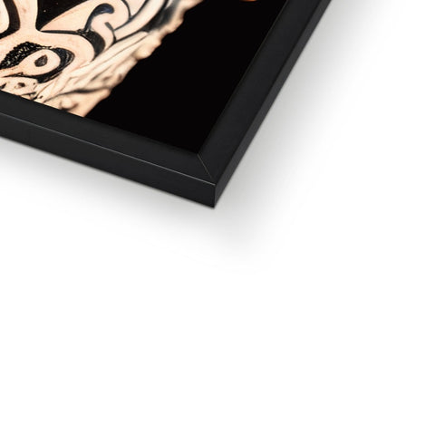A metallic picture frame holding a piece of artwork with a black metal background.