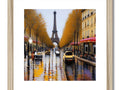 Yellow and gold picture of Paris street on a white frame.