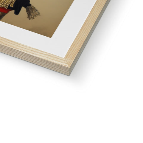 A framed photograph is on paper sitting on top of a wooden frame with a golden background
