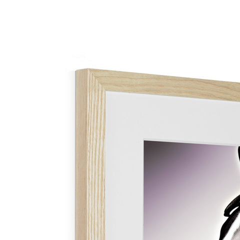 There are picture frames in a frame with wooden frames containing white pictures.