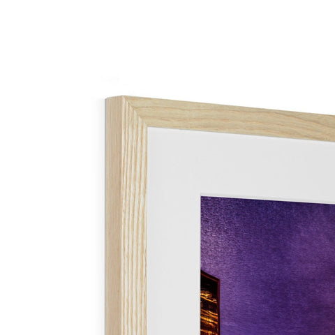 A picture frame holding a close up of a picture in a wood framed frame