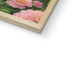 A wooden frame displaying photographs of landscapes with flowers and different animals.