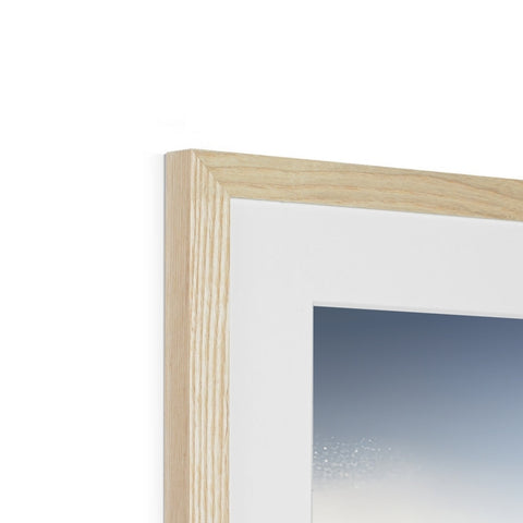 A picture frames in a white frame of a wooden picture.