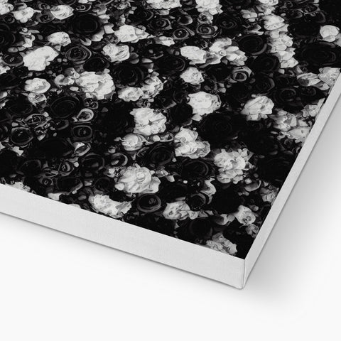 A white paper surface with a black covered rug on top of it.