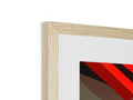 A photo of paintings in a wooden frame hanging and has a red and green photo of