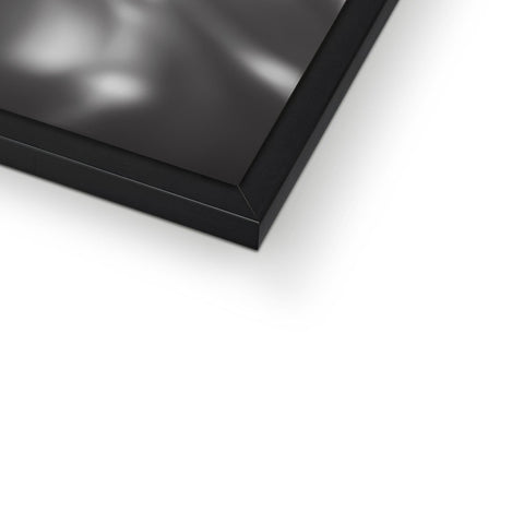 A picture frame on a table of a black metal plate and a white background.