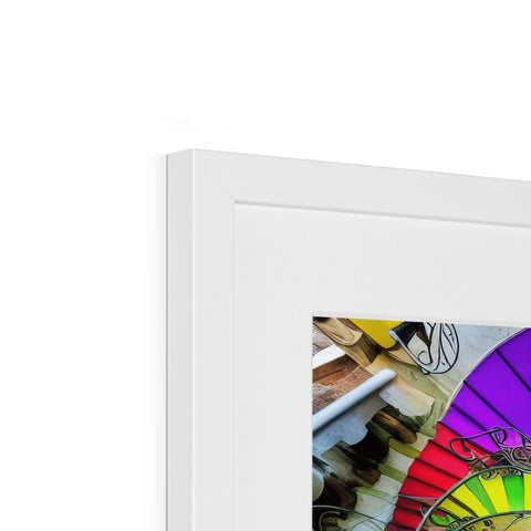 A rainbow photo frame with pictures and a spinning wheel is hanging with an array of colors