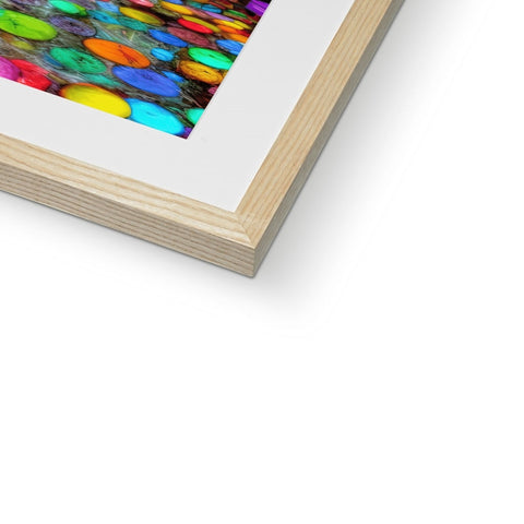 A picture frame with an image of a painting with an abstract design of a rainbow in