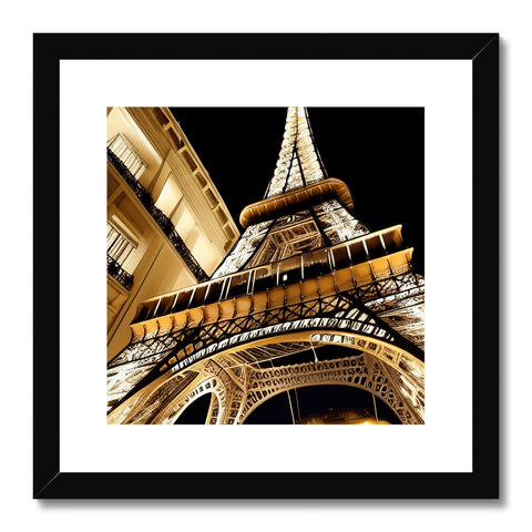A framed photo of the Paris Eiffel Tower on a wall with a metal plate