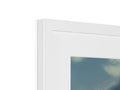 A picture frame hanging over a window under a frosted picture of a glass.
