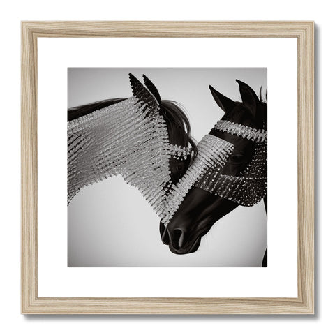 Two black and white blurred views of horses next to each other in a picture frame.