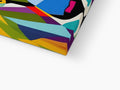 A pillow with a colorful design in it on a wooden table.