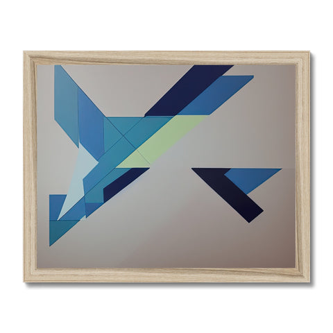 The picture of geometric shape on a small framed art print on a wall.