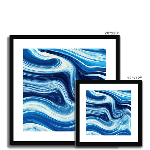 A black and blue art print is hanging on a wall covered with white waves.