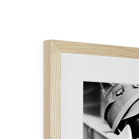 A wooden photo frame with a black and white photo in it with a wooden frame.