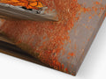 An abstract painting of a rust colored flame on a metal frame