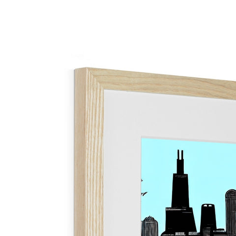 A wooden picture frame with a skyline and a city is in it