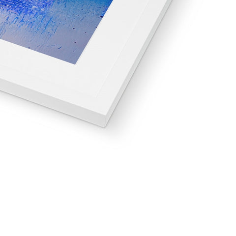 A picture of an abstract image on a white wall with an image of blue.