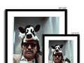 A picture frame with white background of a cow standing next to a mirror.