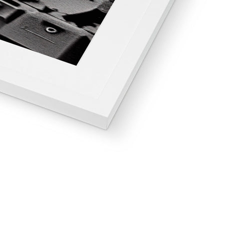 A white photo on top of a book.