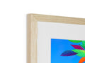 A white picture frame framed on a wall that has a tropical scene.