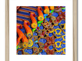 colorful wooden art print with various designs on it in a room.