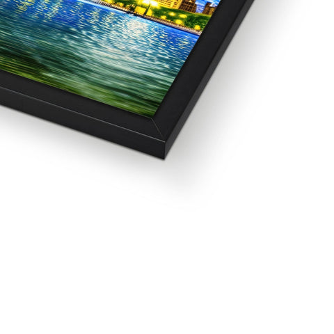 A picture frame with a large picture on top of some computer display screens on it in