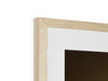 The frame on a photo frame hanging in a tall mirror is framed with wood.