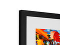 An art print is displayed on top of a framed picture frame.