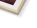 A photo of a white book in a wooden frame.
