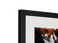 A flat panel photo with a picture frame that has a frame on edge by it.